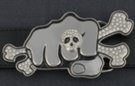 rhinestone belt buckle showing fist with skull and bones