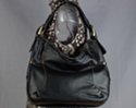 black hobo tote with soft shoulder strap and oversize gold buckles
