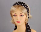 black headscarf with white polka dots attached to plastic headband