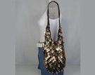 black crochet sling bag spangled with gold tear-drop sequins, sheer lining, magnetic closure