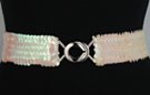 iridescent white sequin stretch belt with silvertone maxi interlocking buckle; has very light ivory cast