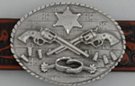 oval western belt buckle, crossed revolvers, badge and spurs