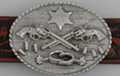 oval western belt buckle, crossed revolvers, badge and spurs