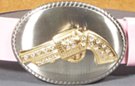 brushed chrome oval with rhinestone studded gold revolver