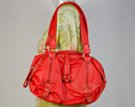 bright red padlock fob slouchy handbag with ruched ends and cargo shoulder straps