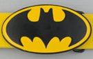 oval bat silhouette black and yellow enameled belt buckle