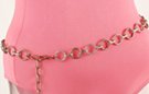 chain belt: small cross-hatched bronze rings, two shades alternate, and joined by silver chain links; stippled bronze chain links form extension chain tipped by tiny heart