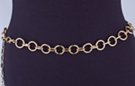 chain belt: smooth gold 7/8" rings joined by textured gold chain links; extension chain comprises very small textured oval and circle links tipped by tiny gold drop