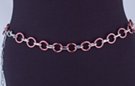 chain belt: smooth pink 7/8" rings joined by textured silver chain links; extension chain comprises very small textured oval and circle links tipped by tiny silver drop