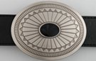 southwest style oval belt buckle, stylized eagle feathers about black onyx