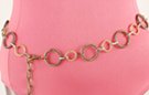 chain belt: alternating medium and small spiral grooved gold and antique gold rings joined by silver chain links; stippled antique gold chain links form extension tipped by small gold ball