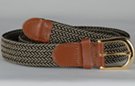 braided woven stretch belt, each chord in braid woven from black and beige thread, tan leather tabs and brass buckle