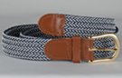 braided knitted stretch belt, each chord in braid knitted from navy blue and white thread, tan leather tabs and brass buckle