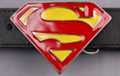 belt buckle, red "S" on yellow enamel shield