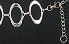 silver chain belt made of tall and narrow ovals