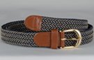 narrow braided knitted stretch belt, each chord in braid knitted from navy blue and beige thread, tan leather tabs and brass buckle
