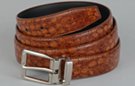 tan tortoiseshell embossed dress belt with silver buckle