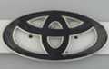 ovals in oval belt buckle looking like Toyota hood mark