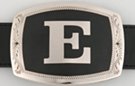 belt buckle with chrome initial "E" on black field