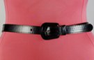 narrow black vinyl fashion belt with guitar-shaped buckle