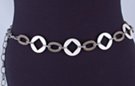 chain belt: white plastic cartwheel rings alternate with big flat cross-hatched antique gold right chain links, all joined by smaller antique silver stippled chain links which also form the extension chain tipped by a small white ring