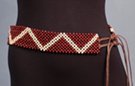 belt of checker-board mesh of ball shape beads, dark cranberry color interlaced with natural wood zig-zag pattern, double-double twine tie-off at either end